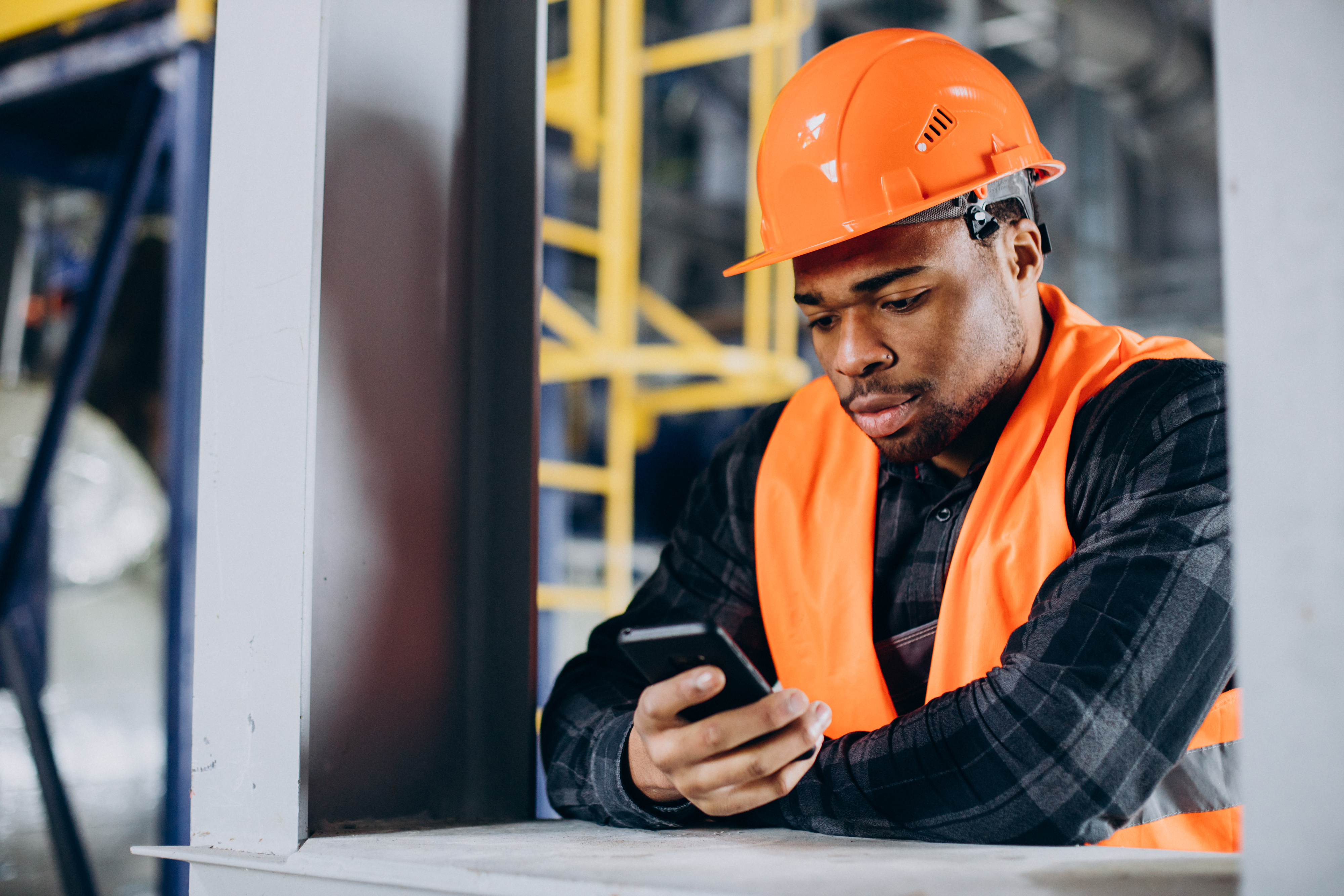 A factory worker on the phone