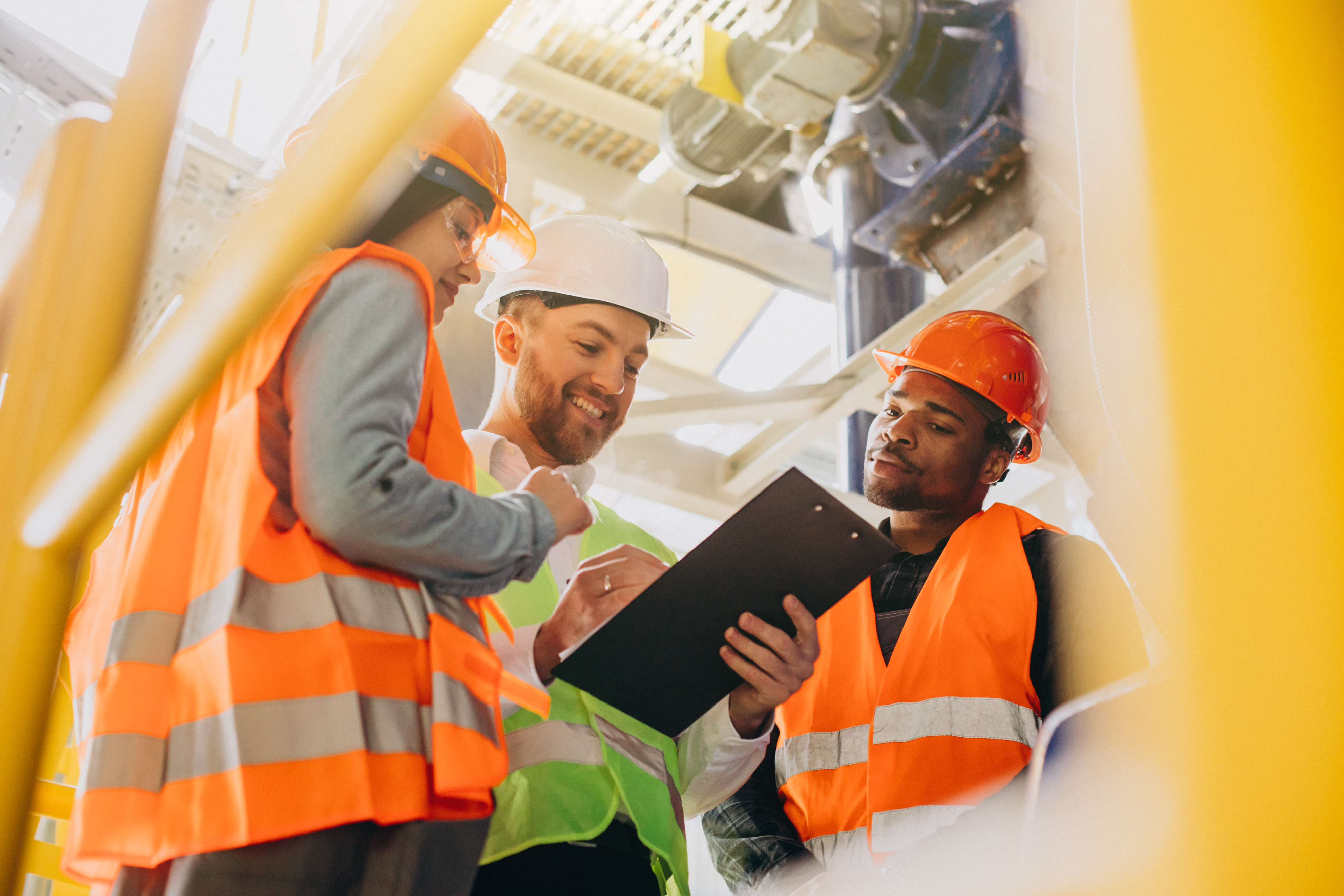 Site supervisors reviewing readings on a clipboard